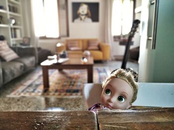 Portrait of boy with toy at home