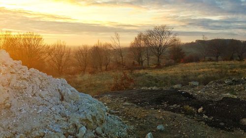 Scenic view of landscape against sky during sunset