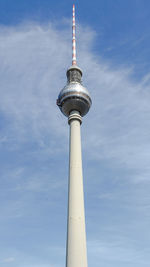Low angle view of communications tower against sky