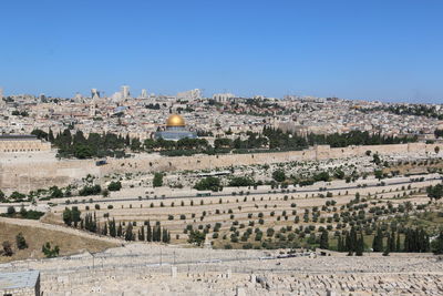 Aerial view of townscape against clear sky