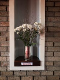 Flower vase against wall