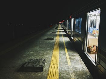 Train at railroad station at night