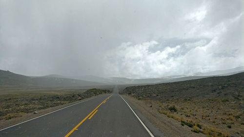 View of road against cloudy sky