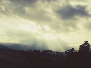 Scenic view of landscape against cloudy sky