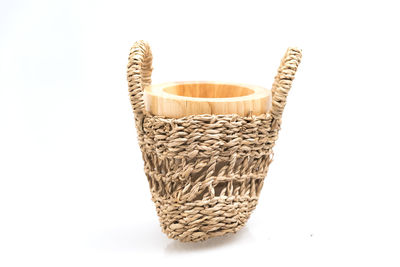 Close-up of wicker basket against white background