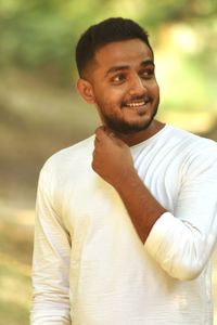 Portrait of young man standing outdoors