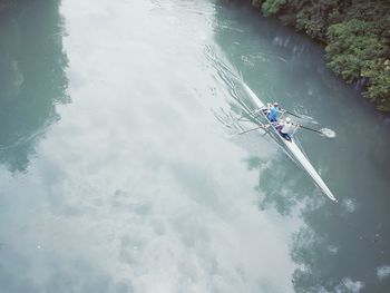 High angle view of people on boat in river