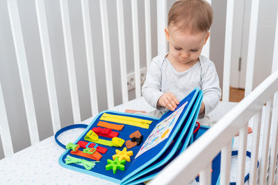 Boy playing with toy blocks