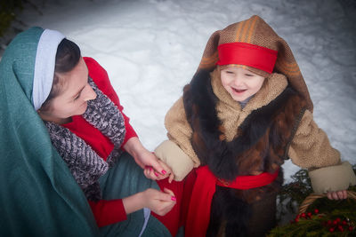 Portrait of smiling friends in snow