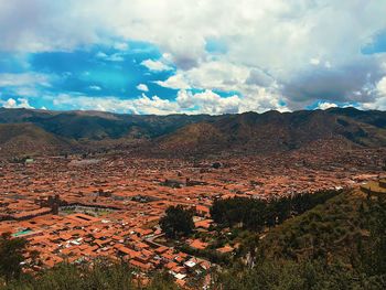 Scenic view of landscape against cloudy sky