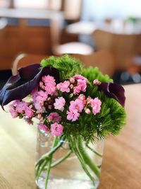 Close-up of pink flower pot on table