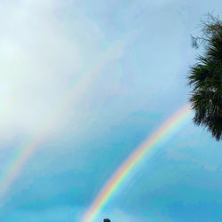 Low angle view of rainbow against sky
