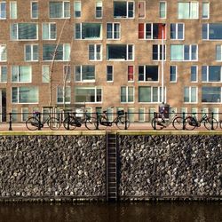 Bicycles parked against building