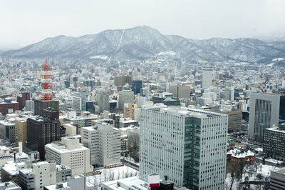 Cityscape with mountain range in background