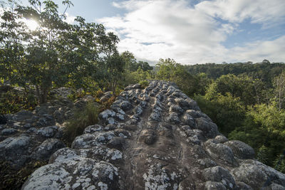 View of rocks on land against sky