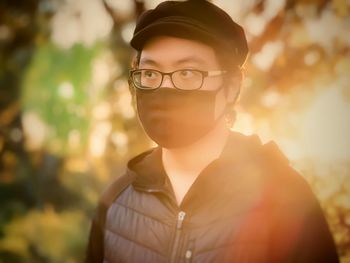 Portrait of young man standing outdoors