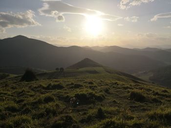 Scenic view of landscape against sky during sunset