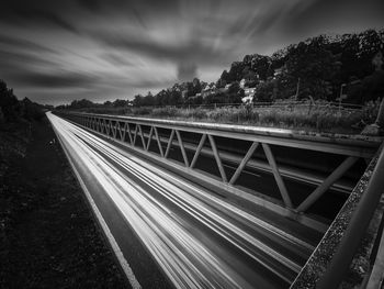 Bridge over road against sky