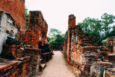 View of old temple building against sky