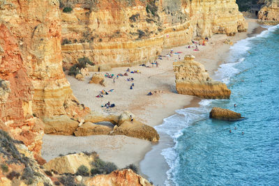 High angle view of rocks at sea shore