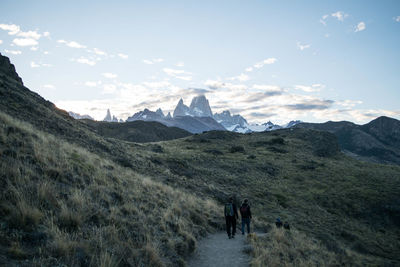 Scenic view of snowcapped mountain against sky and sunset