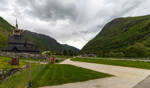 Scandinavian mountains in the village of borgund with stave church and visitor's centre in norway.