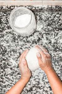 High angle view of hand holding ice cream