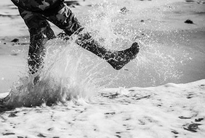 Man splashing water in sea