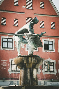 Statue of building in city