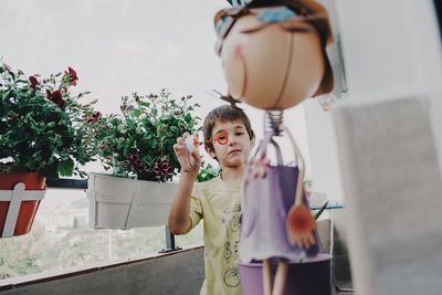Full length of girl standing at home