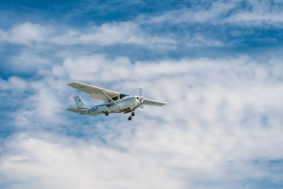 Low angle view of airplane in sky