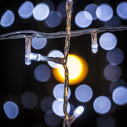 Close-up of illuminated lights at night