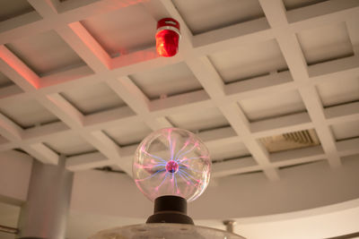 Low angle view of woman holding balloons