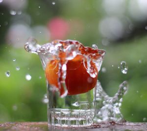 Close-up of water splashing in glass