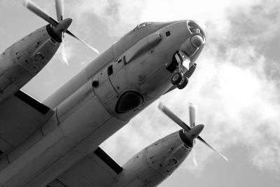 Low angle view of airplane against sky