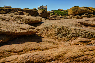 Rock formation on land against sky