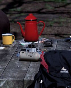 Red kettle on camping stove