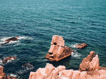 High angle view of rock formation in sea