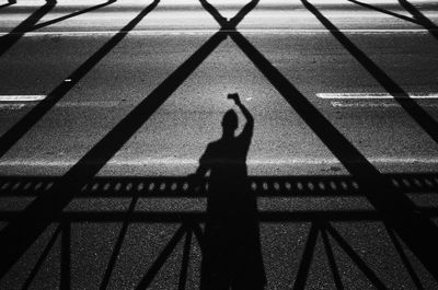 Shadow of person on street