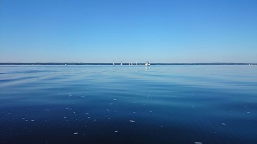 Scenic view of calm sea against clear sky