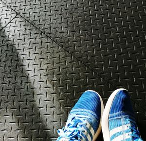 Low section of person on tiled floor