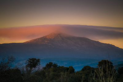 Scenic view of mountains against sky during sunset