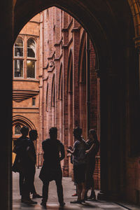 People standing on archway