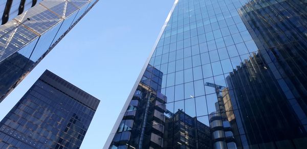 Low angle view of modern buildings against sky