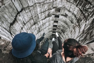 Directly above shot of couple sitting in old building