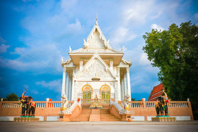 View of temple building against cloudy sky