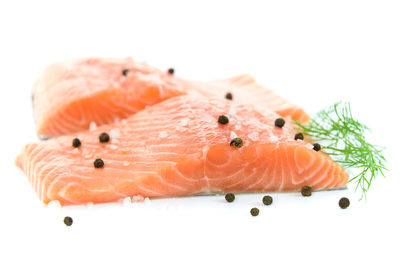 Close-up of orange fish on white background