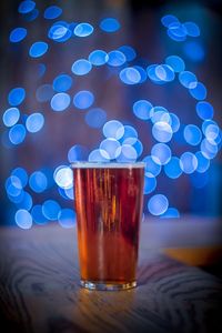 Close-up of beer glass on table