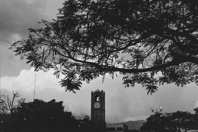 Low angle view of clock tower against sky