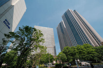 Low angle view of modern buildings against sky